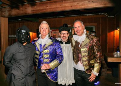 Four people pose for Dunes Resorts' Halloween 2021 party.