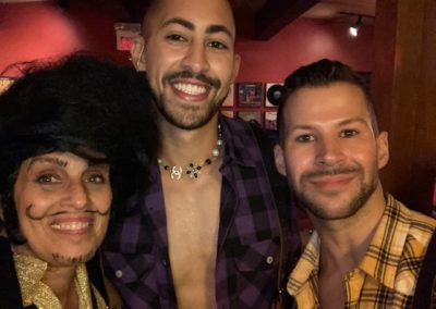 Three people dressed in costumes for Dunes Resorts Halloween 2021 Party