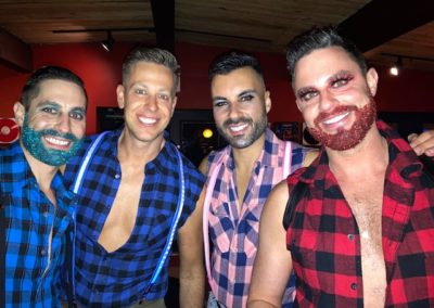 Four people dressed in lumberjack costumes at Dunes Resorts Halloween 2021 Party