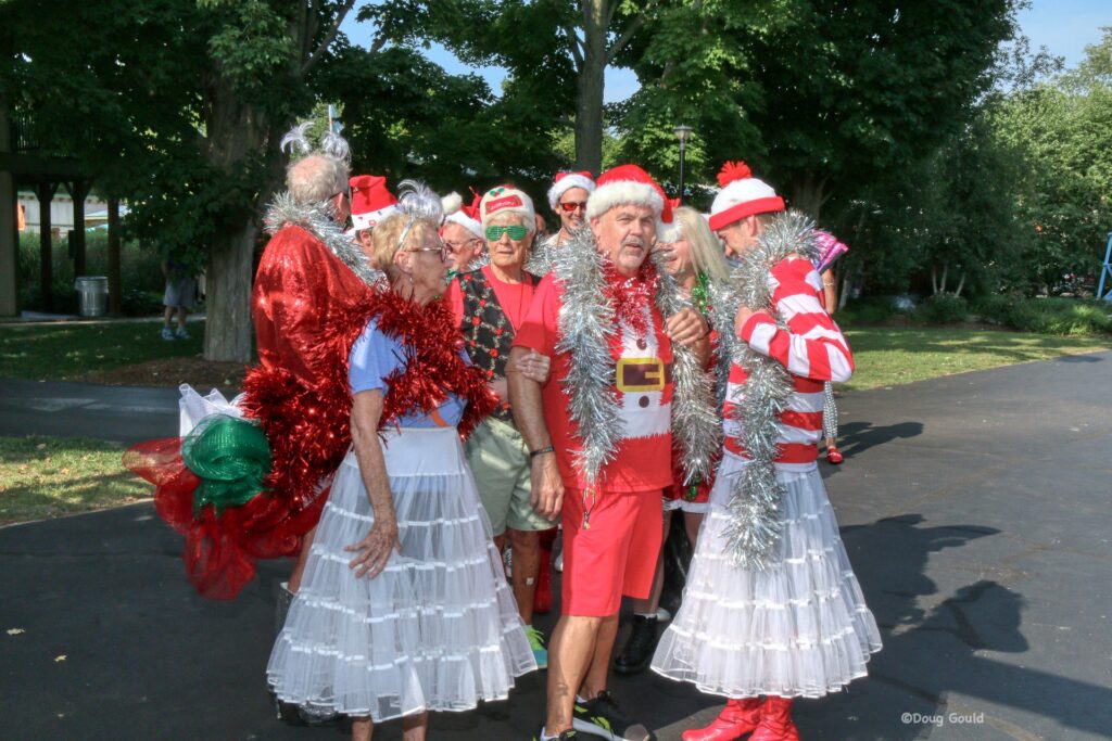 A festive group of Dunes Resort guests pose in Christmas attire.